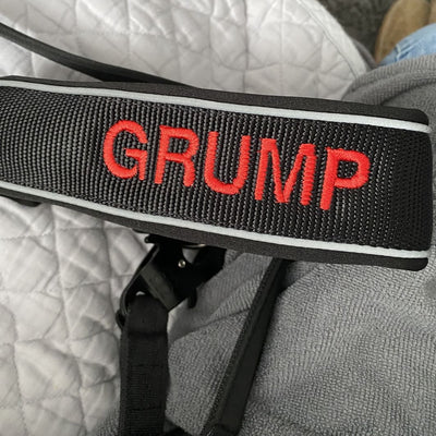 Black collar with red text in block font