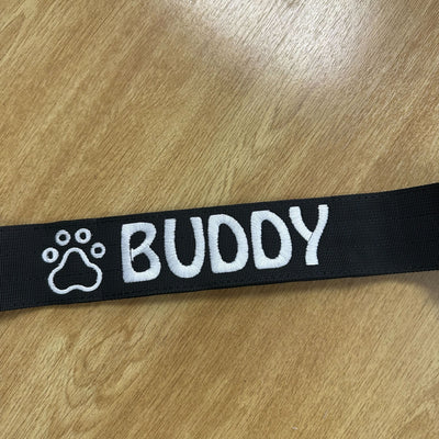Black collar with paw icon and Hobo font in white