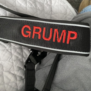 Black collar with red text in block font