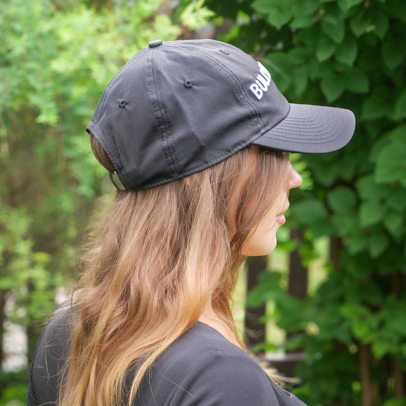 Person wearing a dark gray cap with 'BULLYBILLOWS' logo outdoors