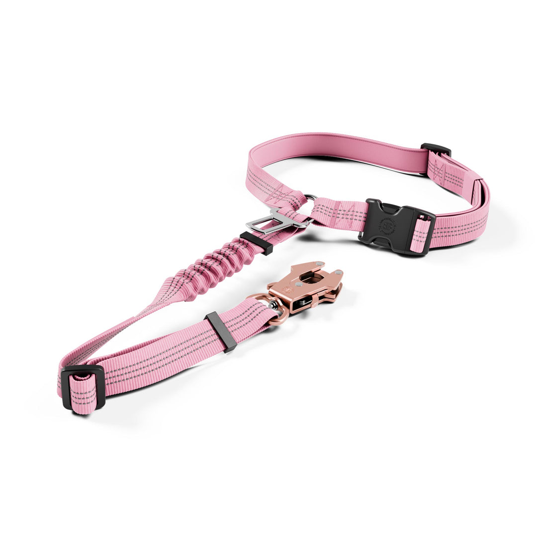 A pink pet harness with black plastic buckles and a silver metal spring ring, displayed on a clean white background.