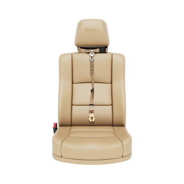 A tan leather car seat with an integrated headrest and seat belt, shown from the front against a solid white background. The brand name 'Bullybillows' is subtly embroidered on the headrest.