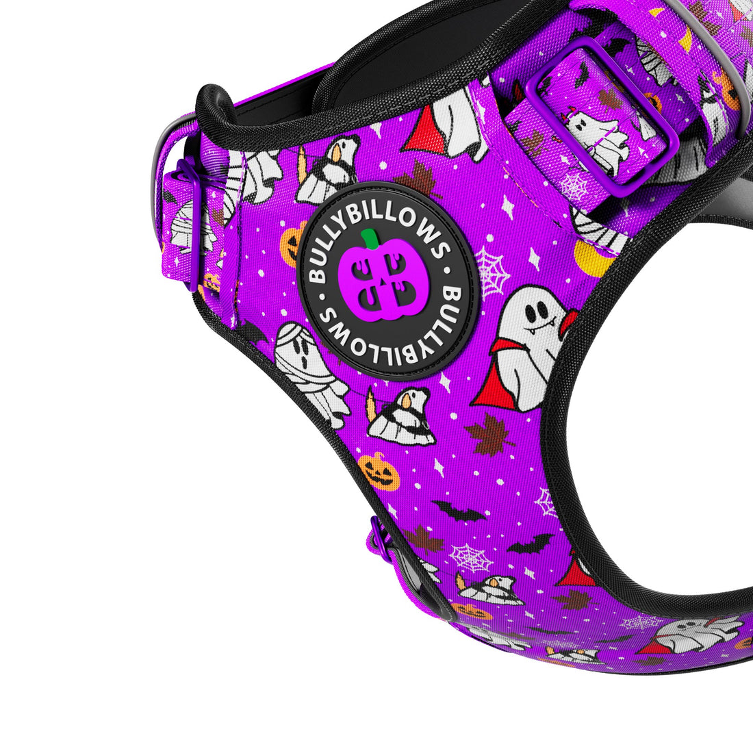 A close-up of a purple pet harness with a Halloween-themed print featuring ghosts, mummies, pumpkins, bats, and stars. A circular black patch on the front reads 'BULLYBILLOWS x BULLYBILLOWS x SPY' in white text.
