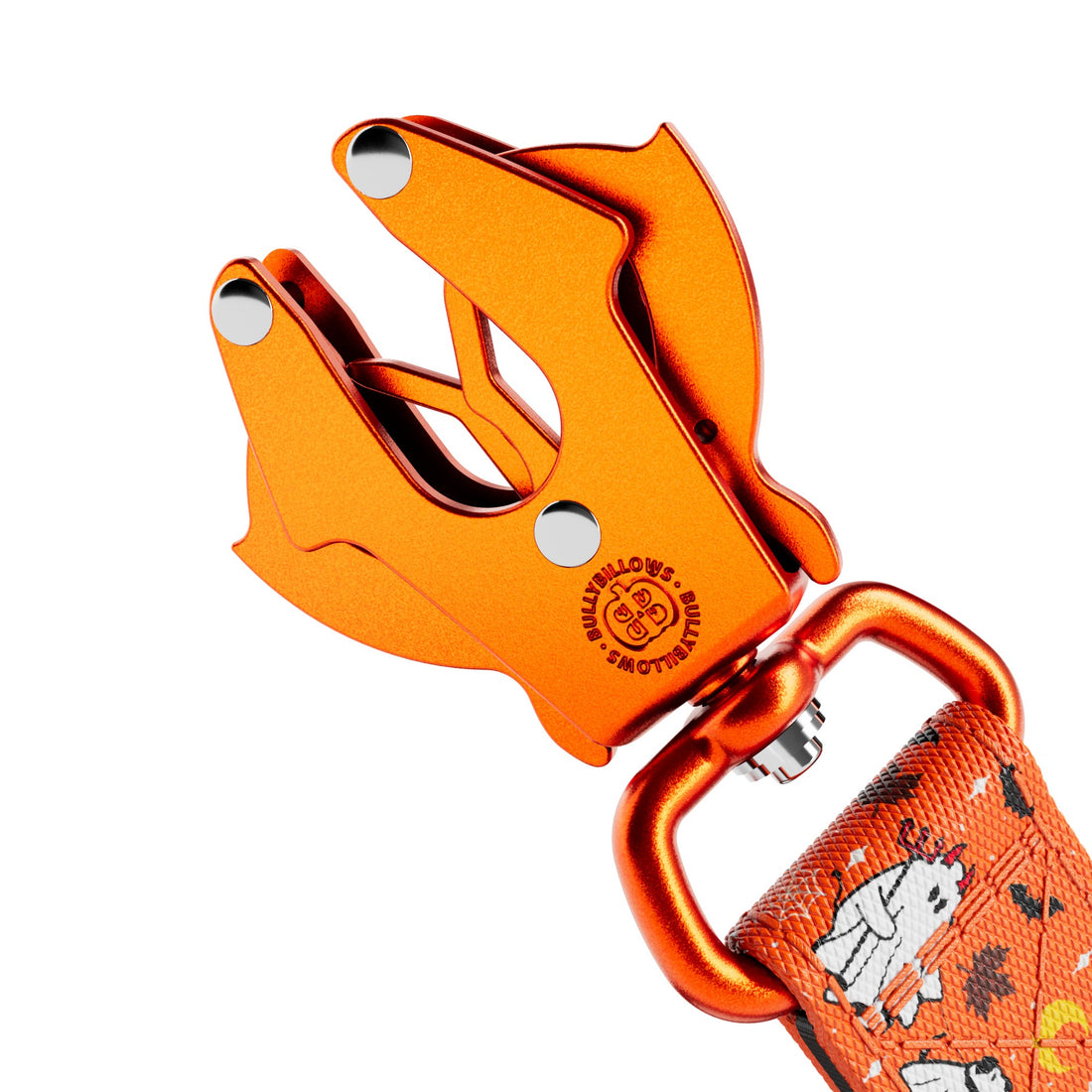 Close-up of an orange metal clip attachment with a patterned orange strap featuring cartoon cow illustrations, shown on a white background.